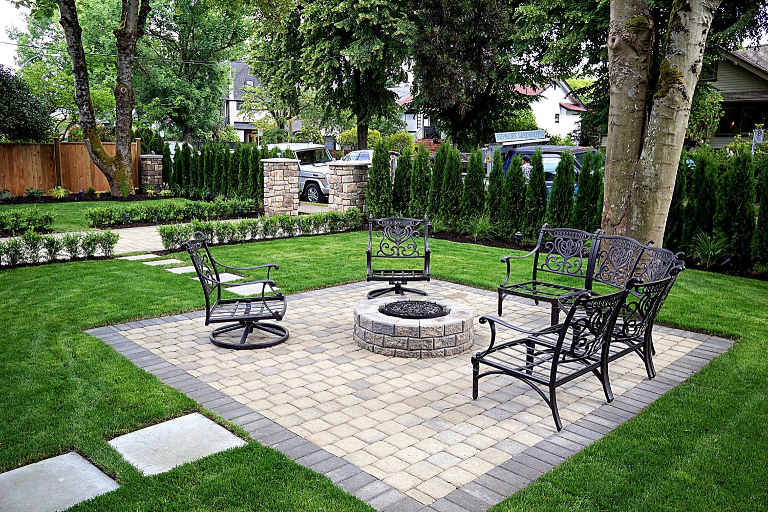 Fire pit patio set into a lawn
