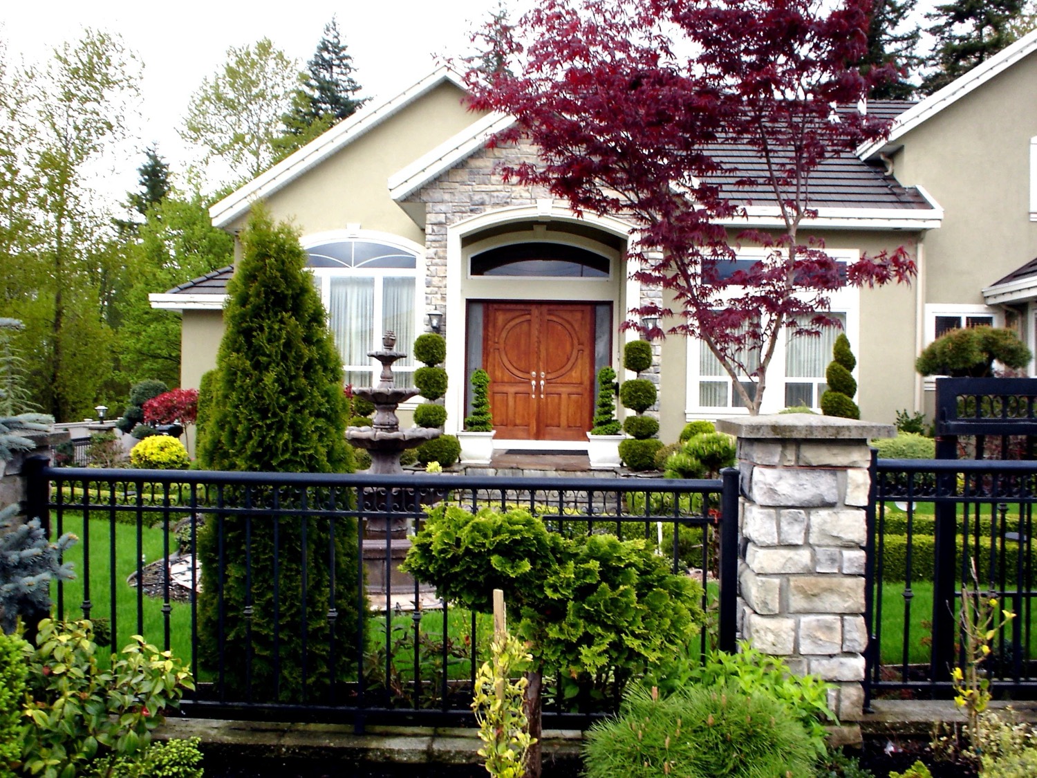 A planted entrance with mature specimens